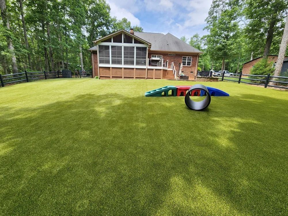 Pet turf backyard with dog agility equipment